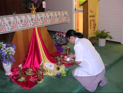 Sr Noelline places the Infant in the Crib on Christmas Eve at Beaconsfield convent