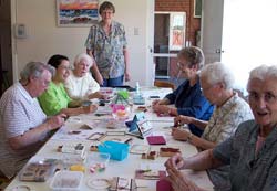 Beaconsfield cty making Christmas cards under the instruction of an expert. 