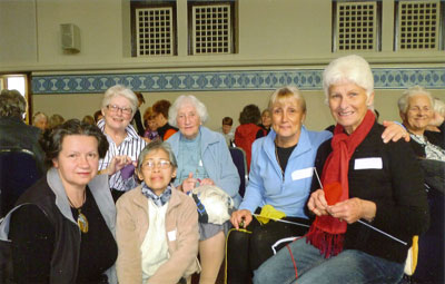 Sr Rose (2nd from left -back) with Manning parish Craft Group at the Anglicare annual 'Knit In' for the homeless at Perth Town Hall 