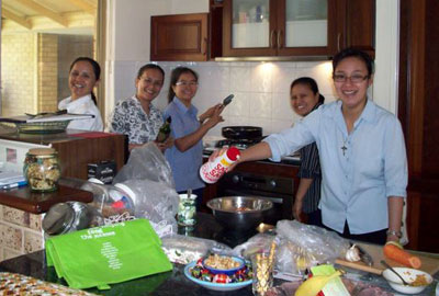 Visiting Srs from Thailand join the 'locals' to cook Thai food together at the Kardinya house